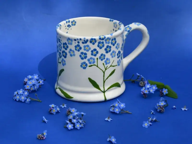 Hand-painted mug with blue forget-me-not flowers, from Hannah Berridge